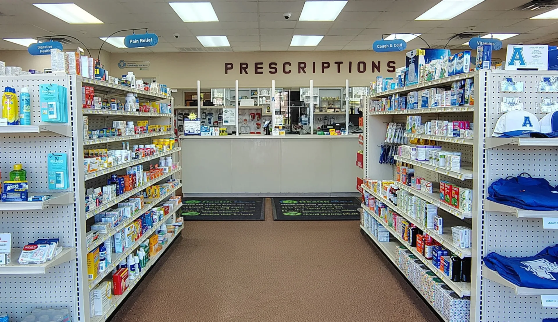 Parkway South retail floor with supplements, OTC medicine, and local team-spirit goods